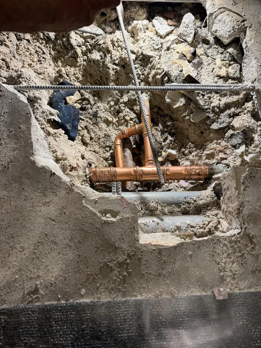 Copper water line repair opened in a concrete slab
